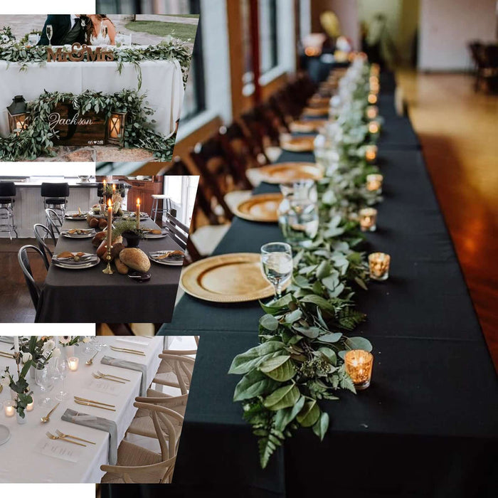 Elegant dining setup with greenery and candles for an event.