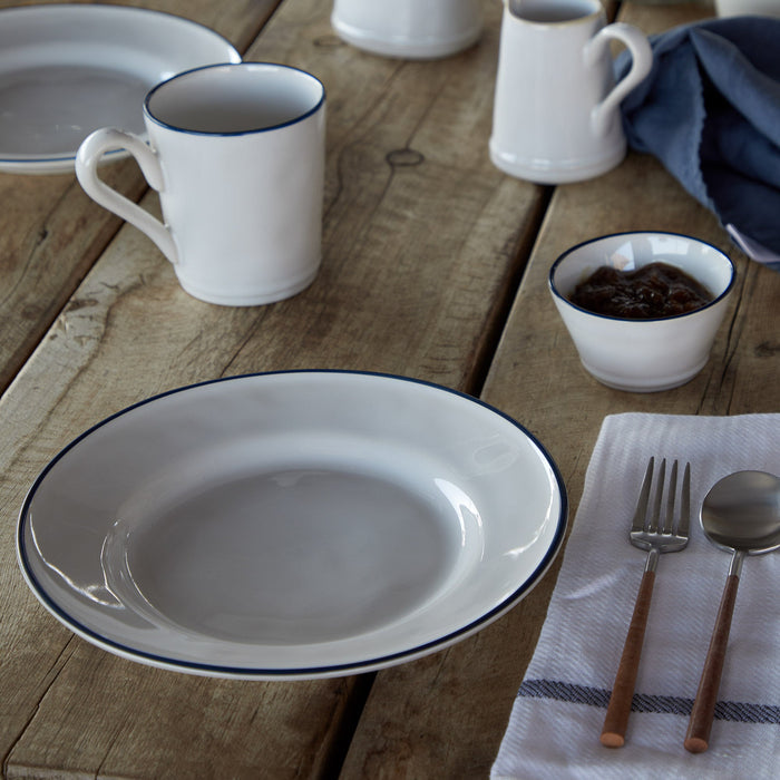 Beja White and Blue Stoneware Salad and Dessert Plate — styled with coordinating tableware; individual item sold separately