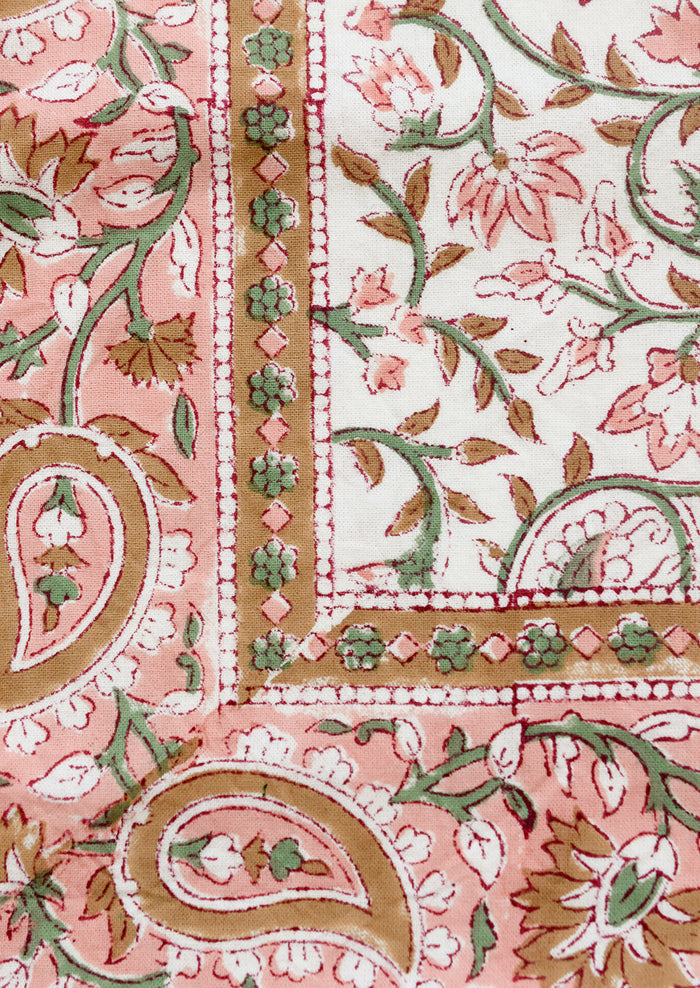 Close-up of a pink and green floral patterned fabric
