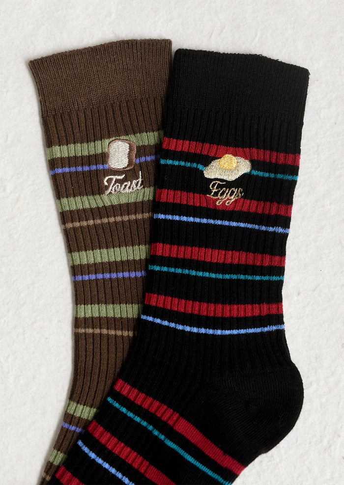 Striped socks with embroidered breakfast motifs.