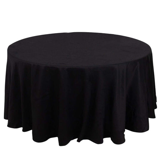 Round black tablecloth with elegant draping for dining or event use.
