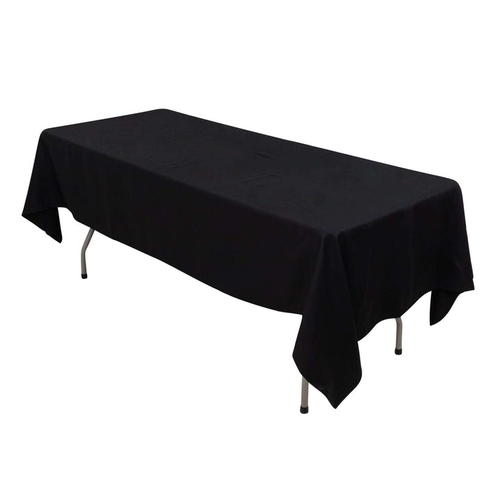 Black tablecloth draped over a folding table.