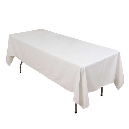 White rectangular table with a draped tablecloth
