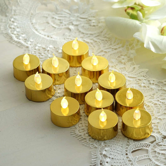 Gold LED tealights arranged on a lace tablecloth.