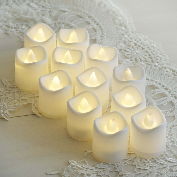 Set of 12 flameless LED candles in soft white, perfect for home decor.