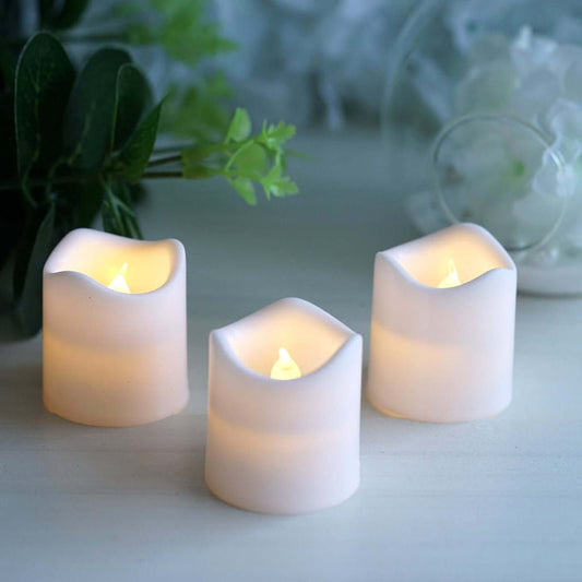 Set of three LED candles with a soft glow, perfect for ambiance.