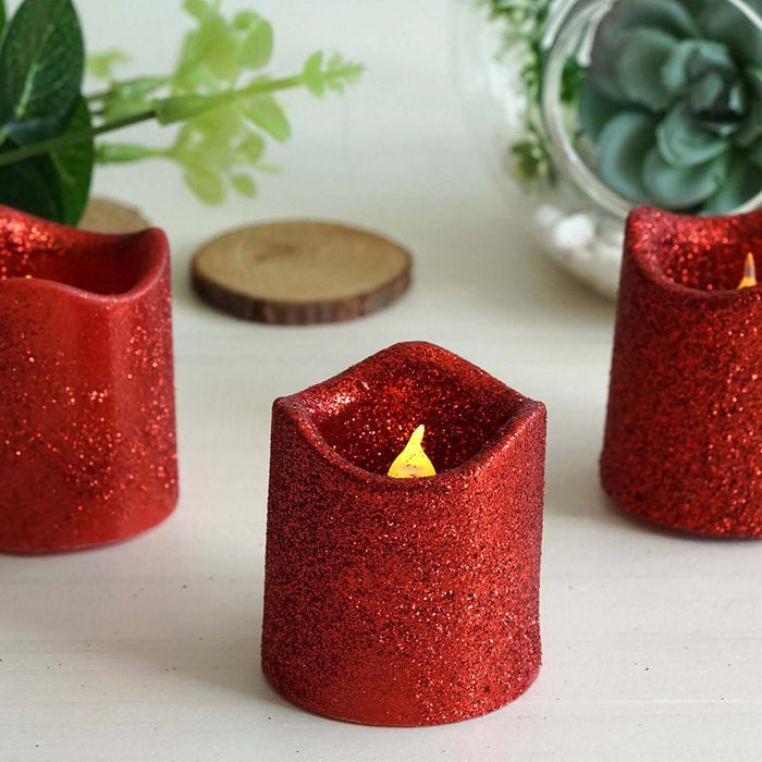Red glitter candle set with LED flickering flames, perfect for festive decor.
