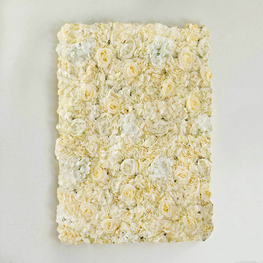 Floral wall art panel in soft white and cream tones against a plain background