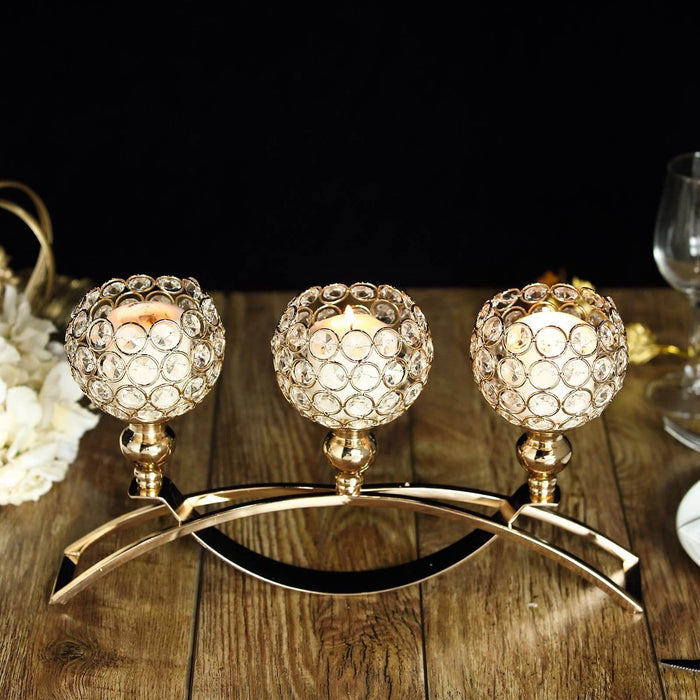 Elegant three-bowl candle holder with crystal accents and a gold base.