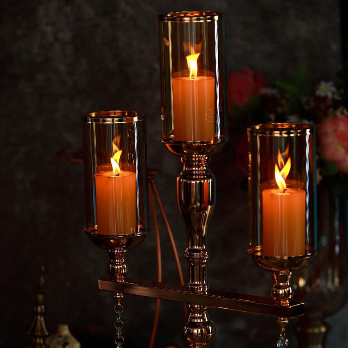 Elegant candle holder with three lit candles, showcasing warm, inviting ambiance.