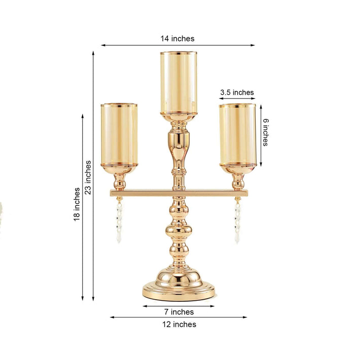 Gold candle holder with three glass votives, 23 inches tall, 14 inches wide.