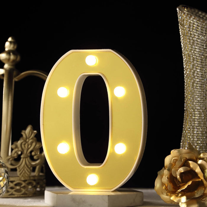 Decorative illuminated number zero with lights on a marble base. #whtbkgd