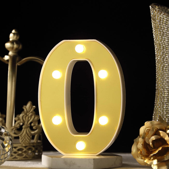 Decorative light-up number zero with LED bulbs on a dark background. #whtbkgd