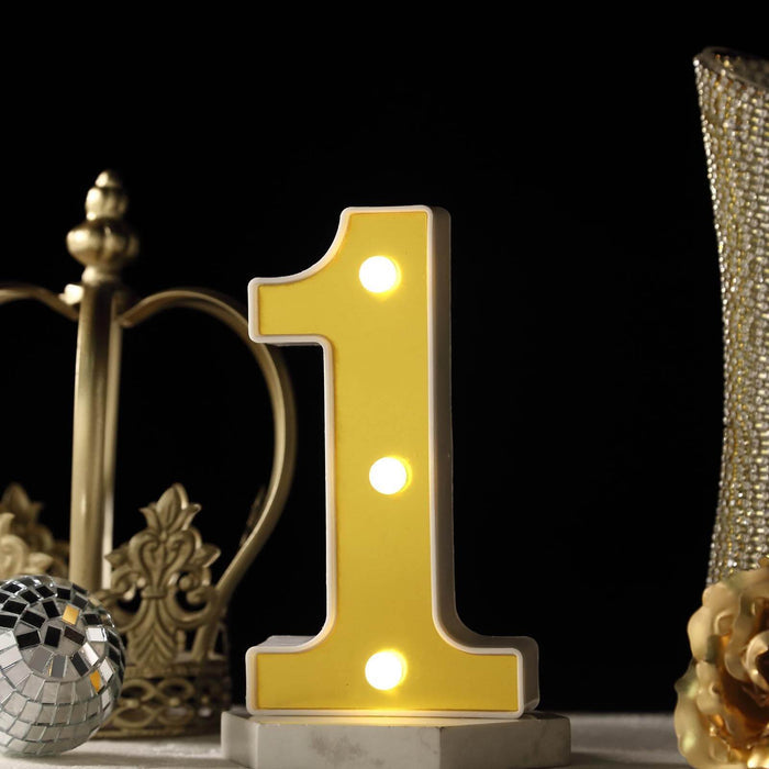 Yellow illuminated number one decoration on a dark background. #whtbkgd