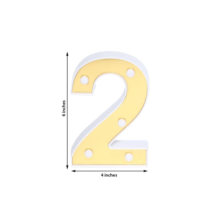 Gold marquee number two sign, 6 inches tall and 4 inches wide.