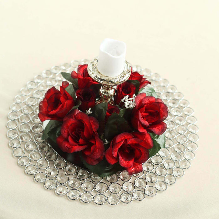 Red rose candle holder centerpiece with decorative gems.