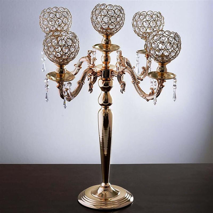 Elegant gold candelabra with crystal accents and five candle holders.