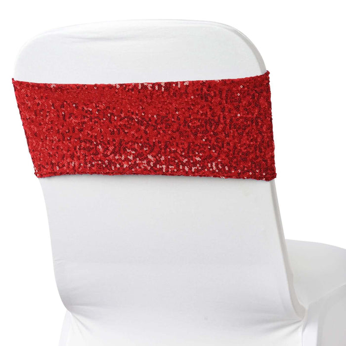 Red sequined chair sash on a white chair back.