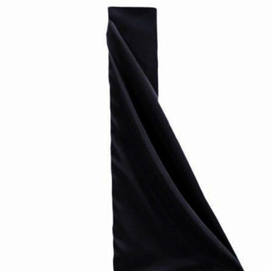 Black fabric draped elegantly on a white background.