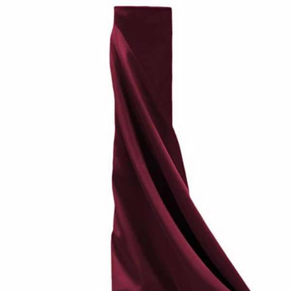 Burgundy fabric drape on a plain background