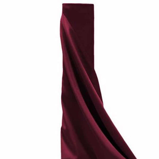 Burgundy fabric drape on a plain background