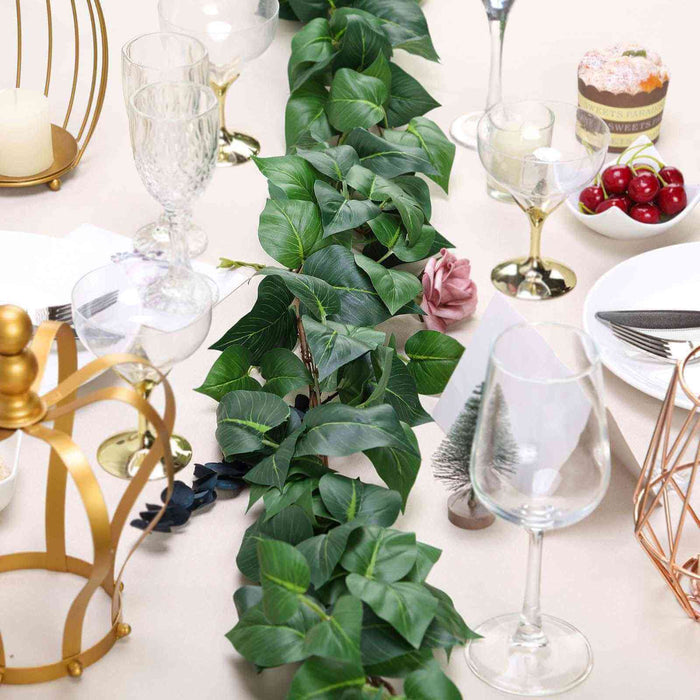 Decorative green foliage centerpiece on a dining table.