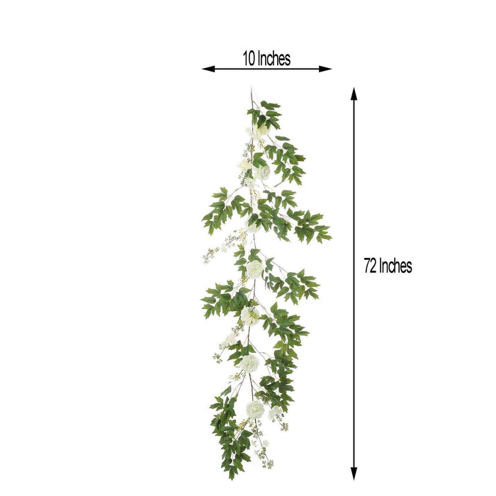 Artificial hanging vine with white flowers, 10x72 inches.