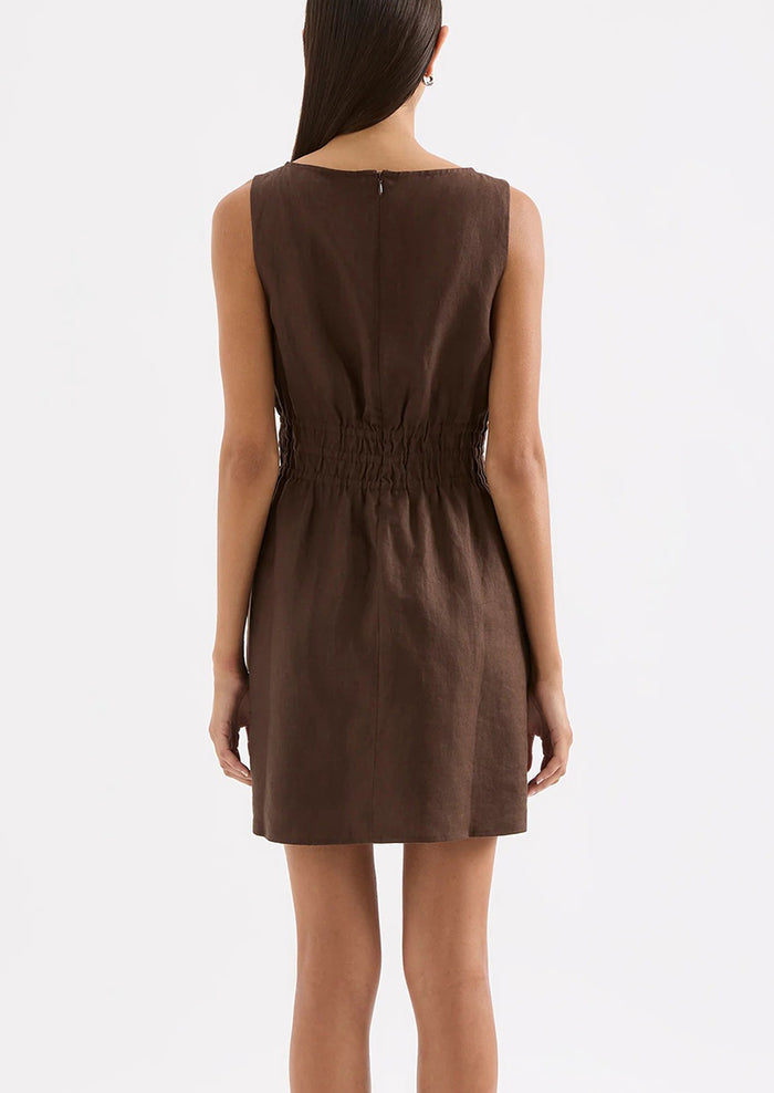 Brown dress worn by a model on a white background