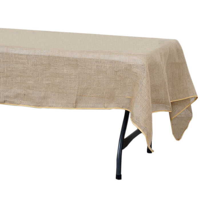 Natural burlap tablecloth with yellow trim, perfect for rustic decor.