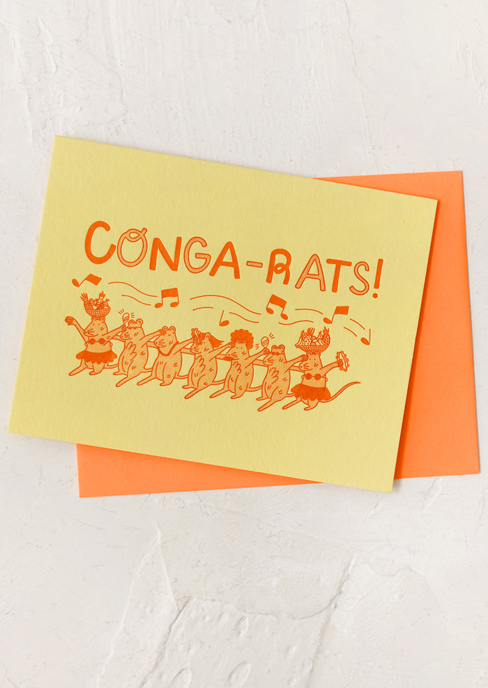 Greeting card with 'Conga-Rats!' text and rat conga dancers on a yellow background with an orange envelope.