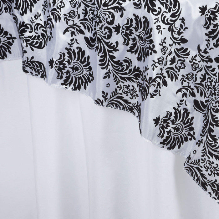 Black and white damask fabric with a ruffled edge on a white background #whtbkgd