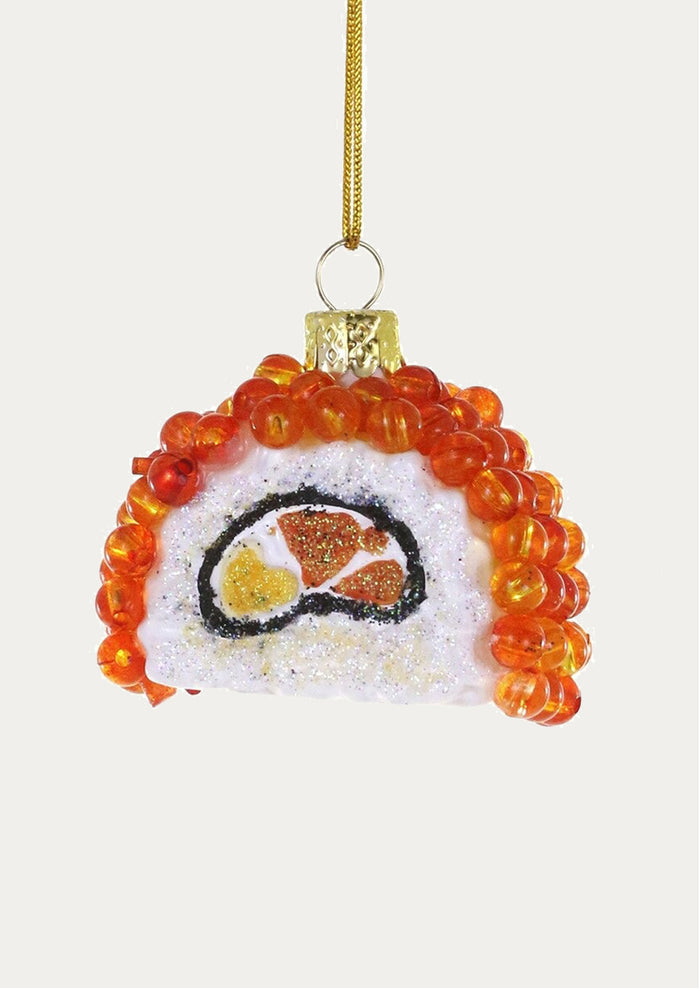 A holiday ornament depicting a sushi roll with ikura on top.