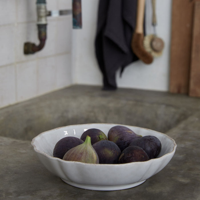Impressions White Stoneware Low Serving Bowl — styled with coordinating tableware; individual item sold separately