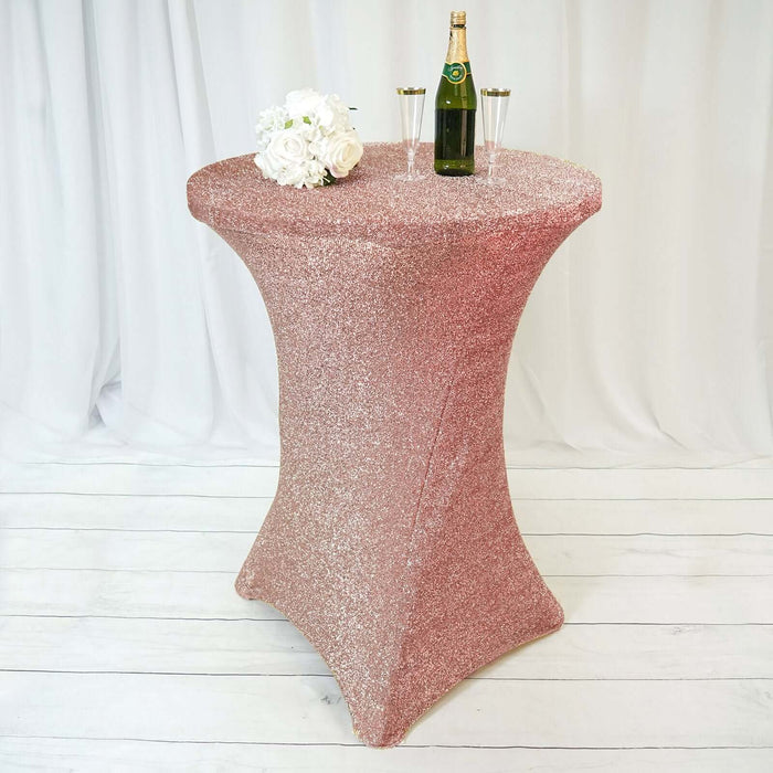 Glittering rose gold table with champagne and flowers in a stylish setting.