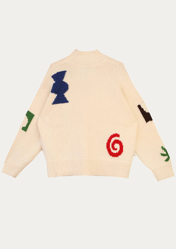 Beige sweater with colorful symbols on a white background