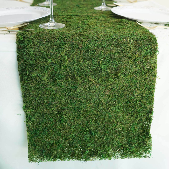 Green moss table runner for rustic decor and events.