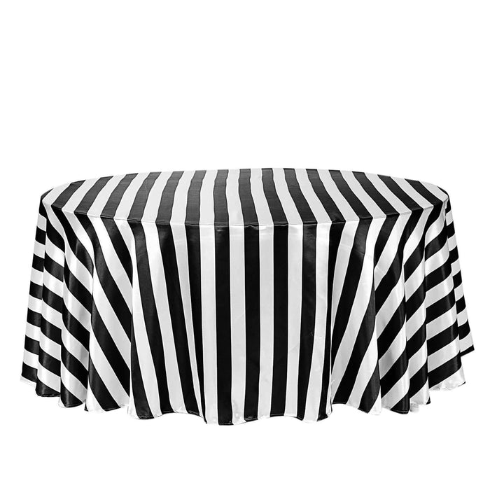 Black and white striped tablecloth on an oval table