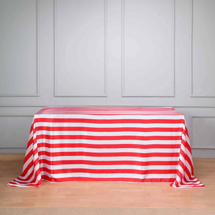 Red and white striped tablecloth on a plain backdrop.