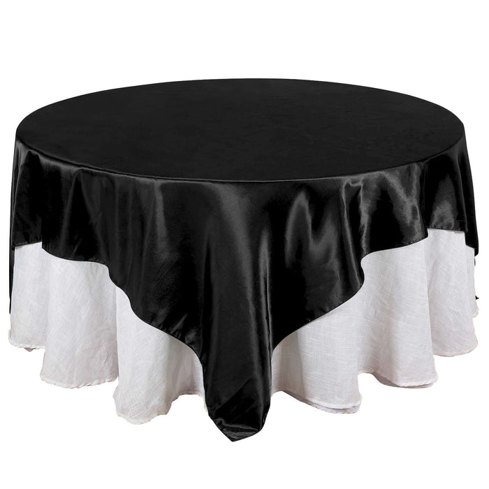 Black round tablecloth with white lace trim