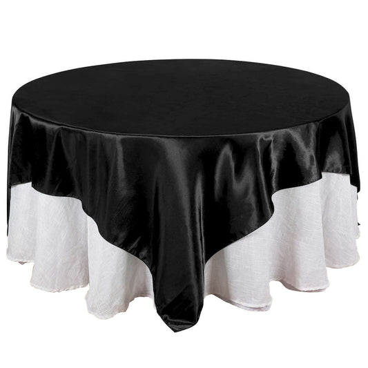 Black round tablecloth with white lace trim