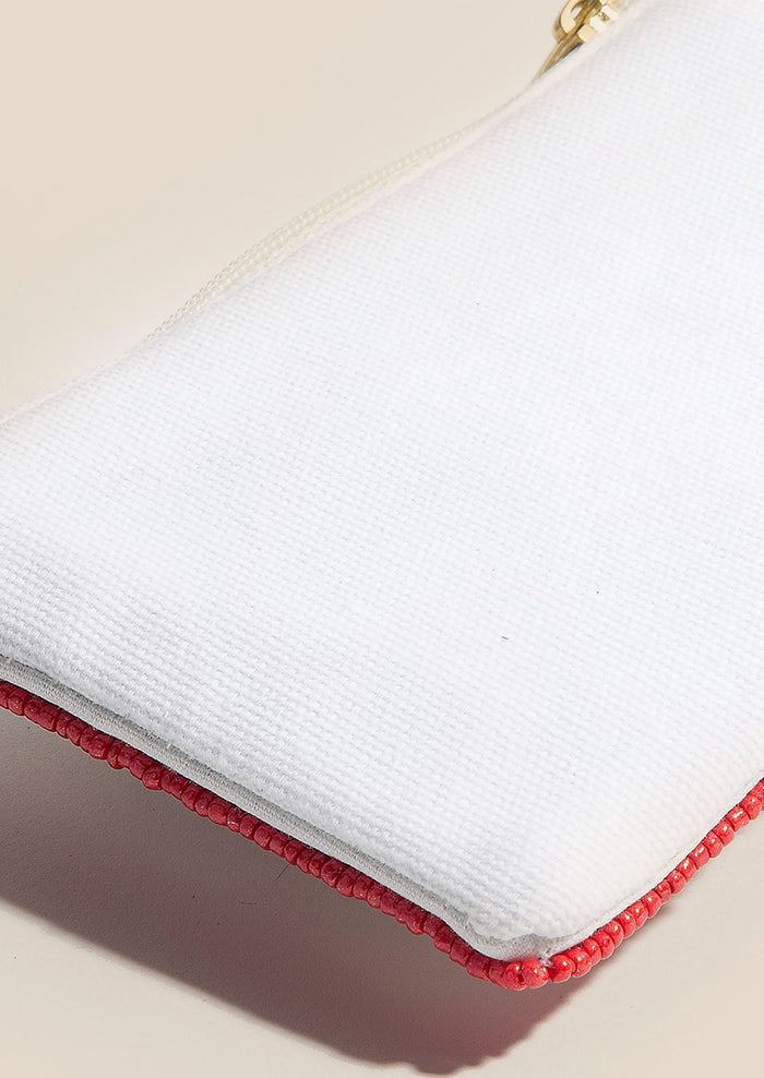 A coin purse with plain white fabric back.