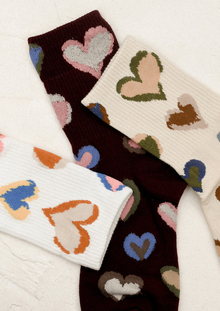 Colorful heart-patterned socks in three color options.