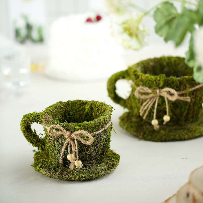 Moss cup with twine decoration on a table setting.