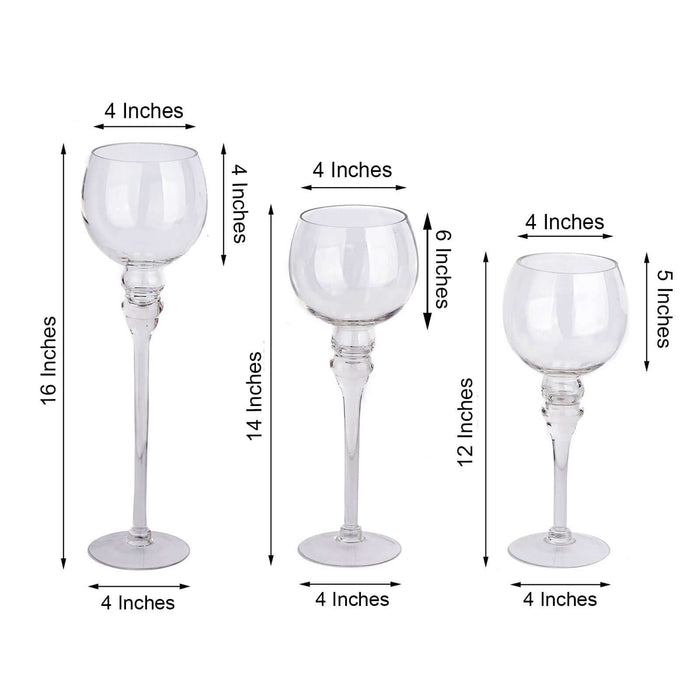 Set of three elegant glass candle holders in varying heights.