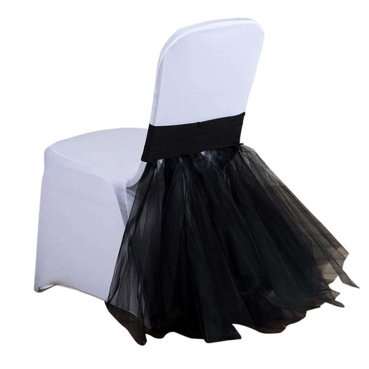 Black tulle chair cover with a sleek design and elegant drape.