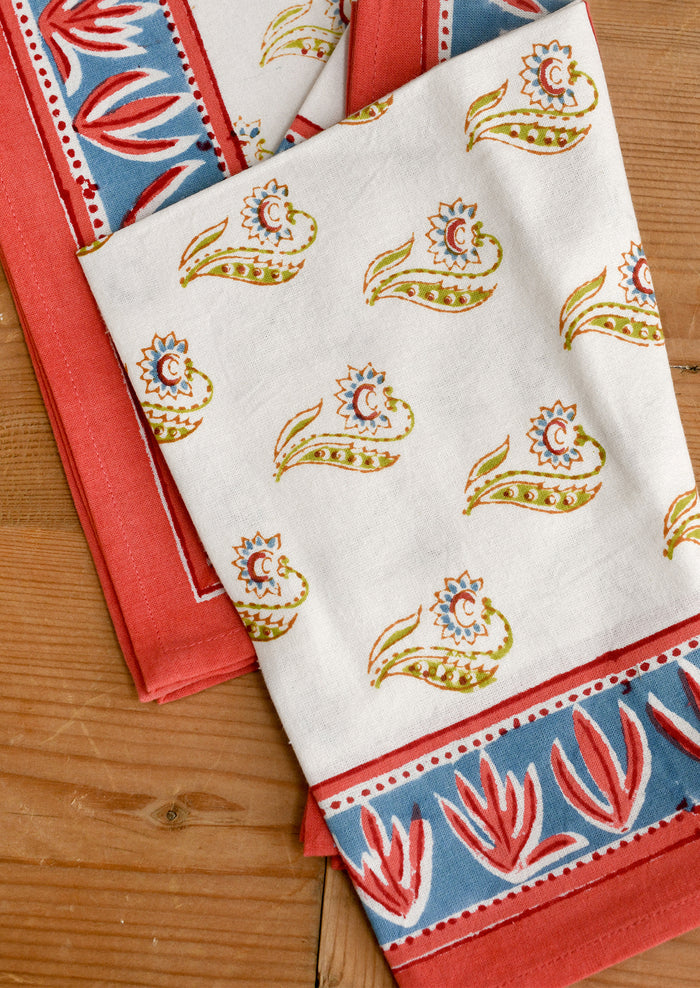 Set of colorful patterned napkins on a wooden surface